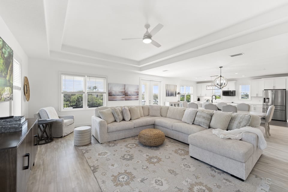 Bright open living area for family gatherings – Spacious seating, modern design, and coastal charm make this the perfect space to unwind together after a beach day.