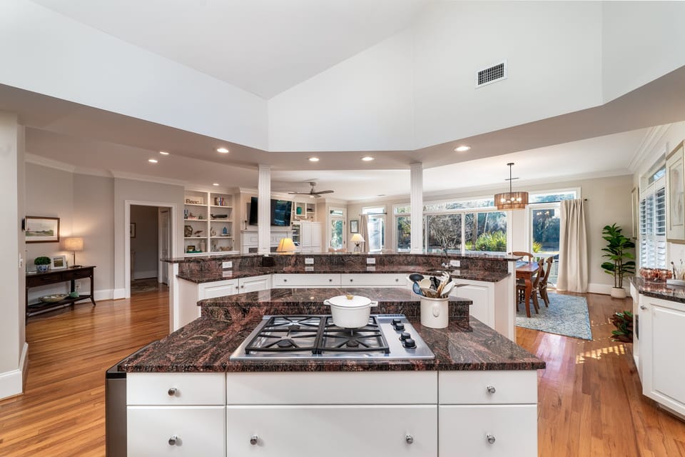 Gourmet kitchen overlooks the dining room and great room