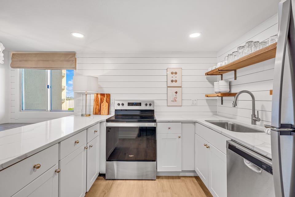 Kitchen - Enjoy cooking in this wonderful, modernized kitchen with open shelving and wonderful counter space.