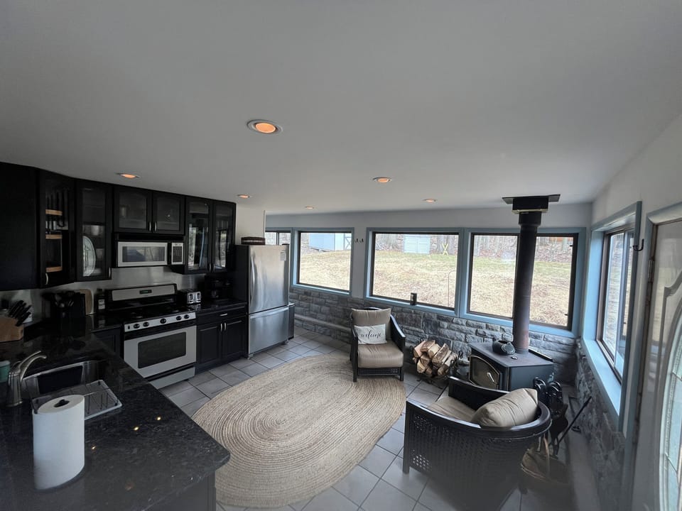 Abundance of windows throughout offer natural lighting and views of nature&lake