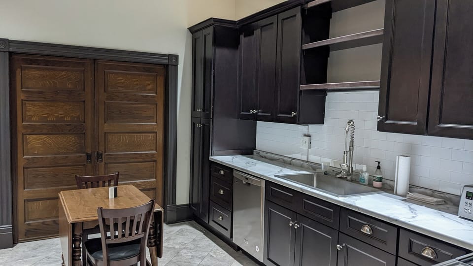 The pocket doors separate the kitchen from the second bedroom