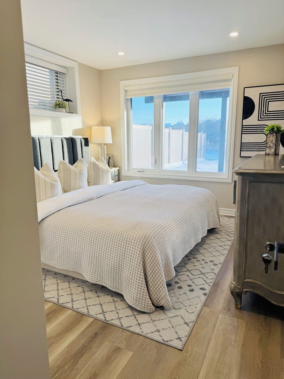 Bed 1 - King Bed: Crisp white cotton bedding, huge closet, sideboard and mirror