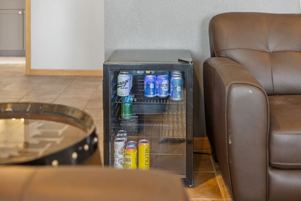 Convenient Mini Fridge – Located beside the sofa for easy access to your favorite drinks and snacks. Perfect for a cozy night in or a quick refreshment after a day of adventure!