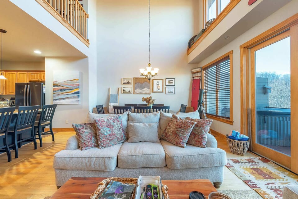  Enjoy panoramic scenery from every angle, thanks to the floor-to-ceiling windows that seamlessly blend the indoors with the outdoors.