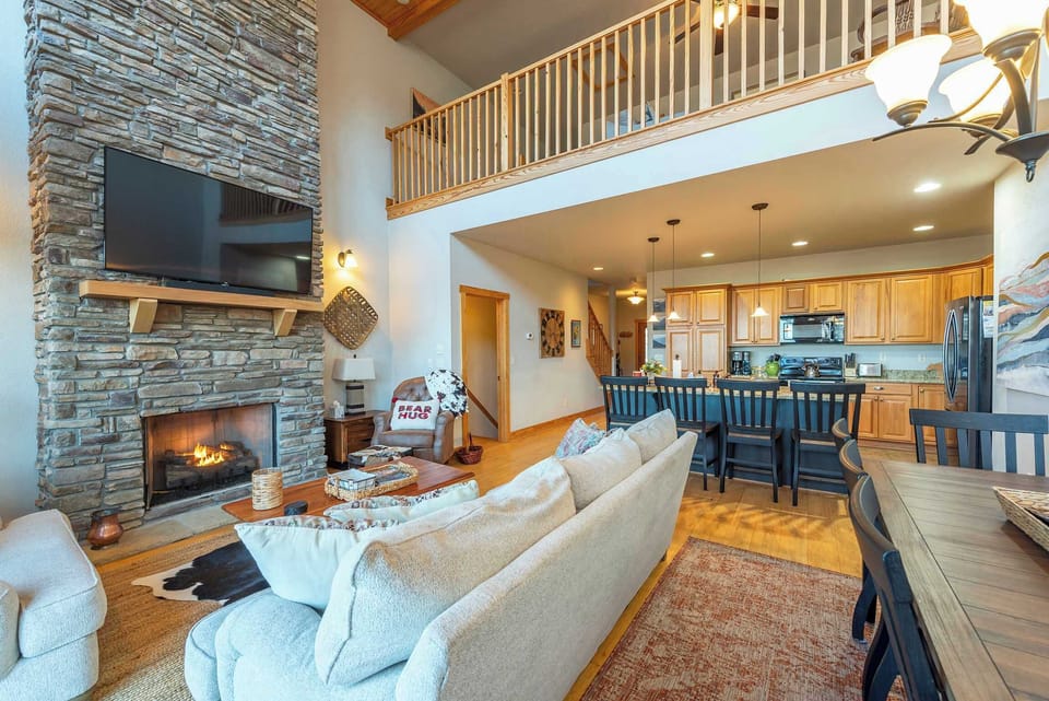 Experience the best of mountain living in a home that offers vaulted ceilings, an expansive open layout, and warm, inviting décor. 