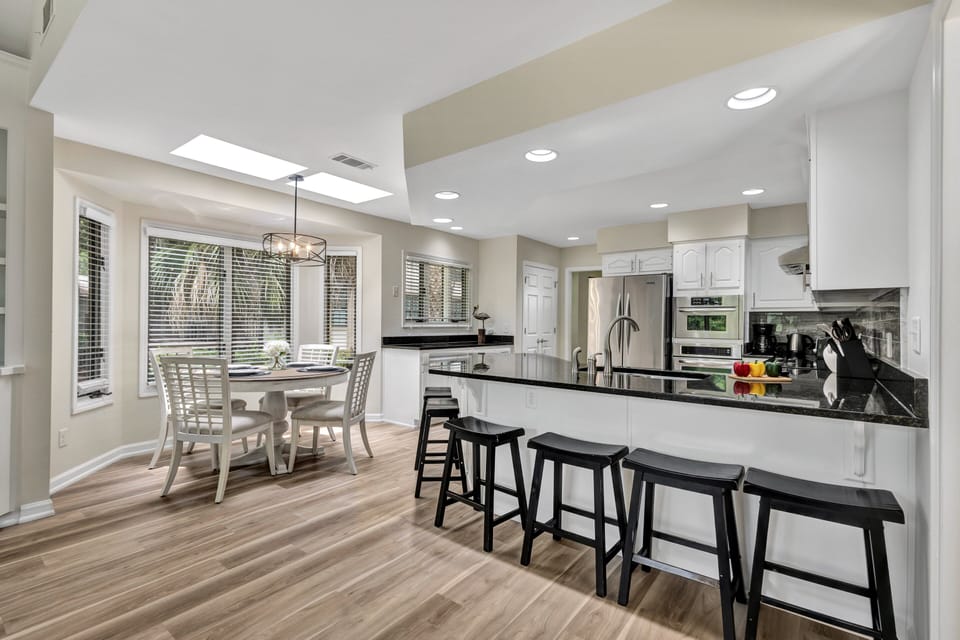 The spacious kitchen provides plenty of seating at the island and breakfast nook