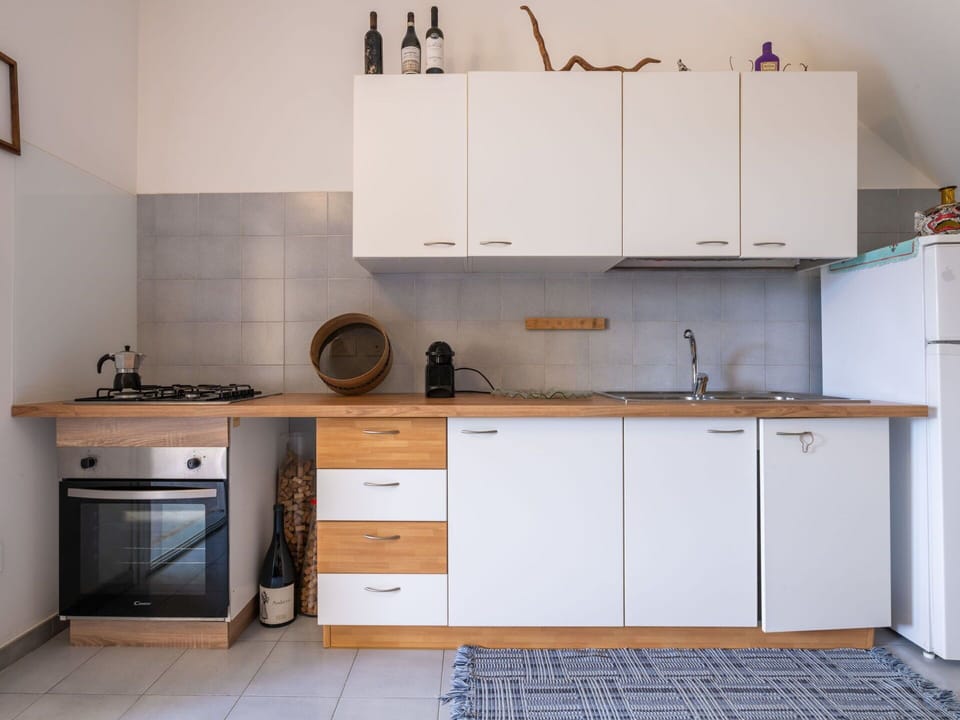 Cabinetry, Countertop, Kitchen, Furniture, Kitchen Appliance, Flooring, Wood, Major Appliance, Interior Design, Kitchen Sink