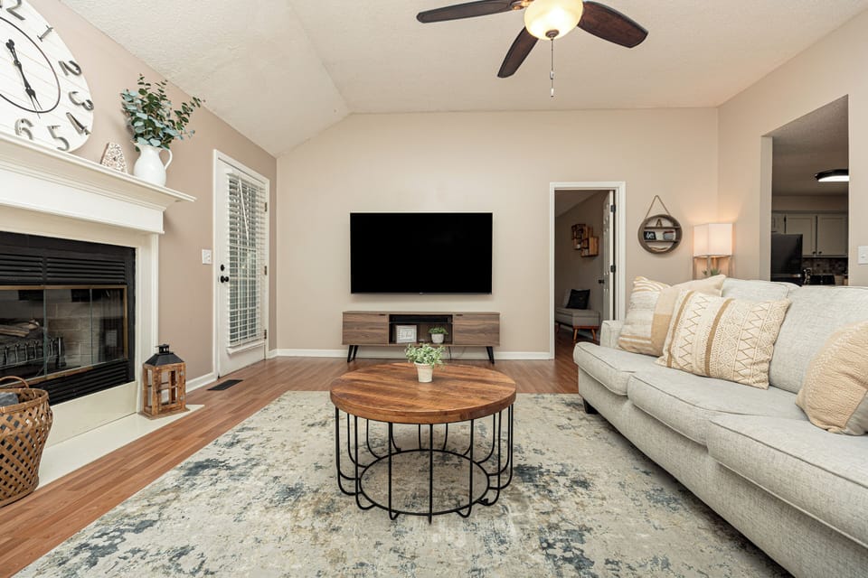 Living room w/ 75 in Smart TV [includes streaming capabilities]