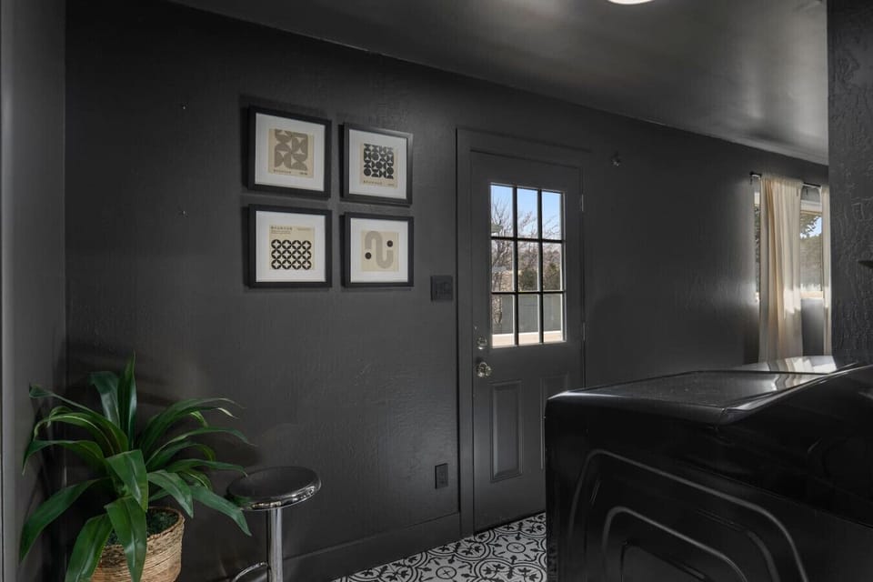 Even the laundry room has style! This chic, modern space makes everyday tasks feel luxurious. With bold black walls, stylish decor, and plenty of natural light, even chores become part of the experience. Functional yet fashionable touch to your stay!