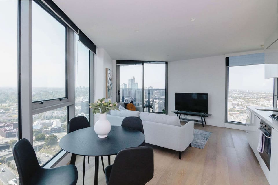Light filled open plan living space with SMART TV, dining table, relaxing sofas and private balcony