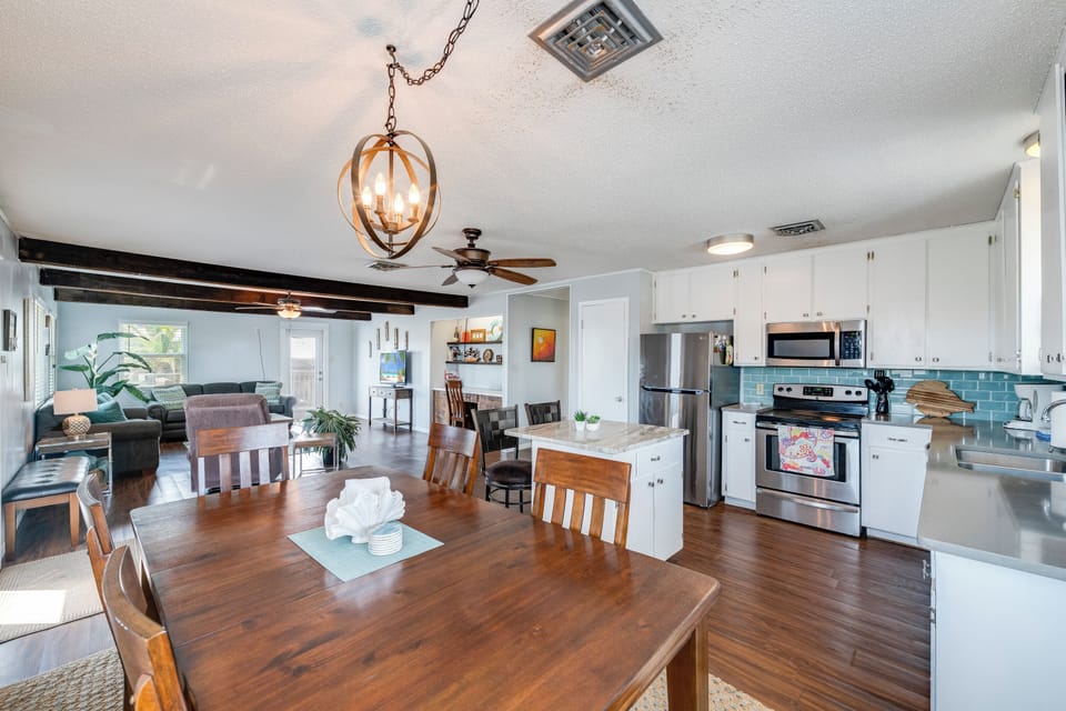 Your open-concept living space flows seamlessly from kitchen to dining to lounge, creating the perfect backdrop for memorable vacation moments together.