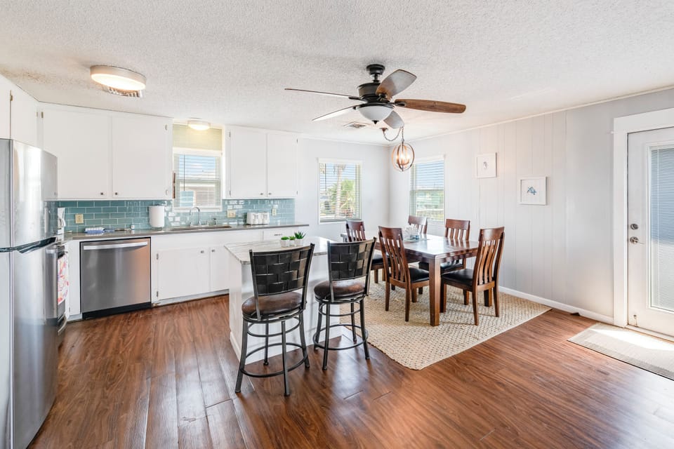 Your bright kitchen flows seamlessly into the dining area, perfect for cooking and sharing meals together.