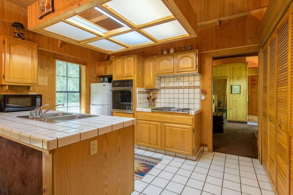 The open kitchen offers ample space & every home comfort