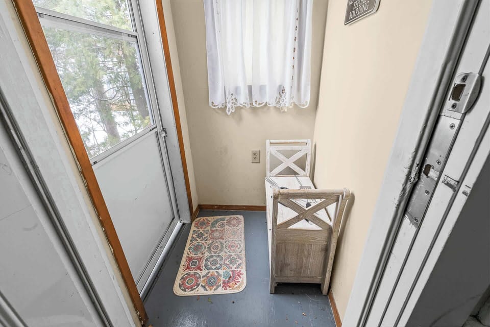 Enter into a small mud room.