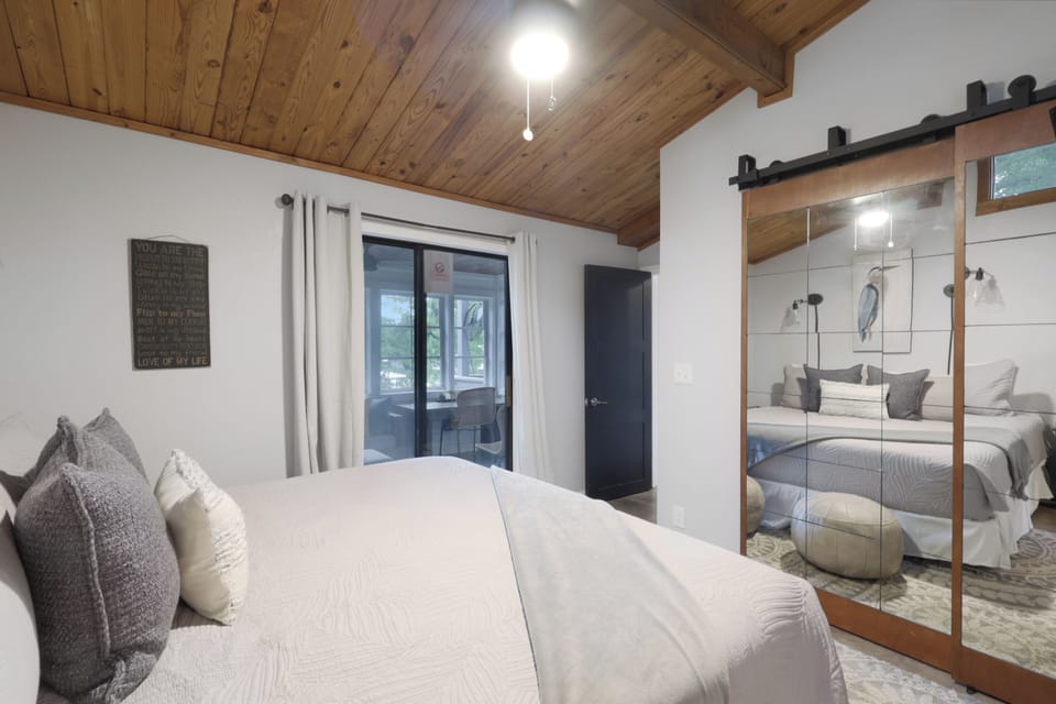 Drift off under the warmth of wood-beamed ceilings, surrounded by plush bedding and modern farmhouse charm that makes every night feel like a restful retreat.