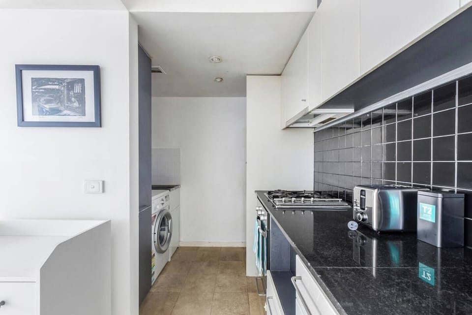 Keep your wardrobe fresh with a private washer tucked into the kitchen—ideal for your longer stays or a quick refresh.
