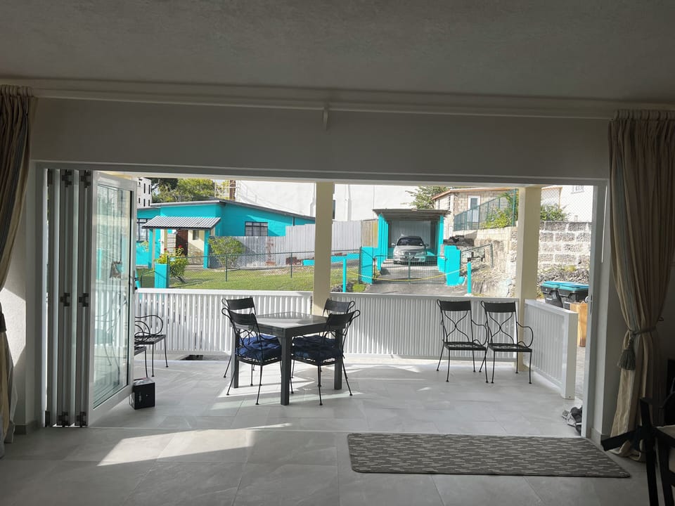 Dining table on covered front porch, expands to seat 6. 