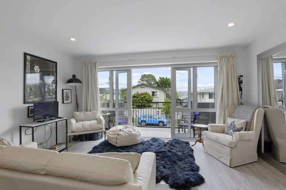 Living room opening up onto balcony
