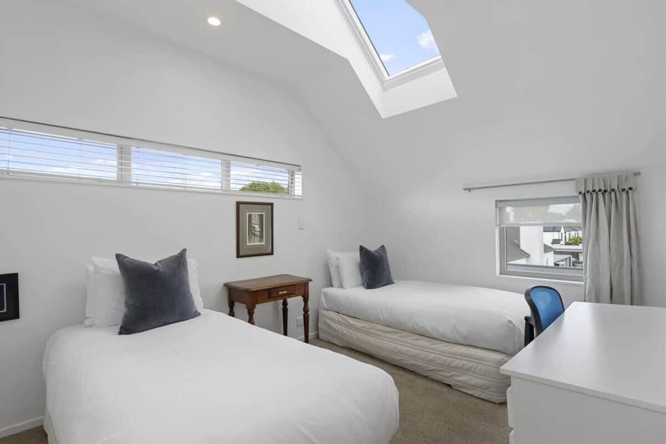 Bedroom with single beds and natural lighting