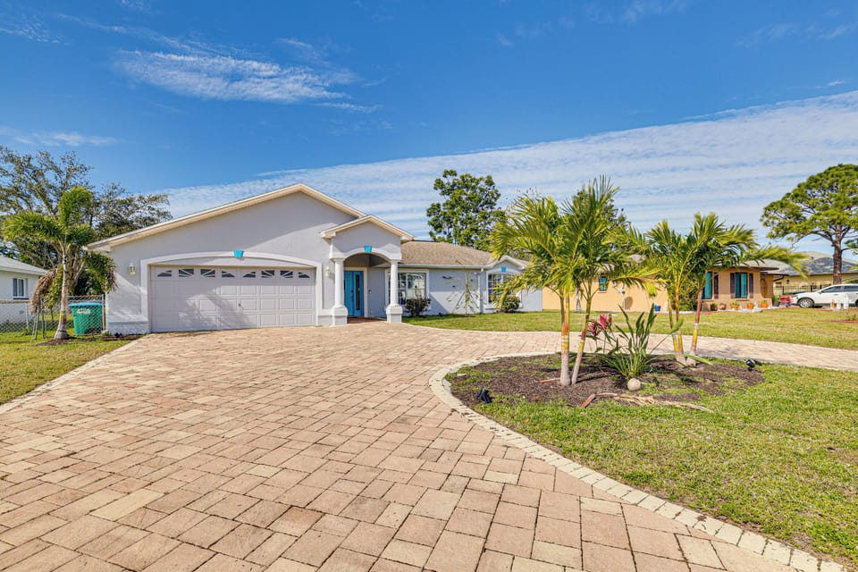 Property Exterior | Screened-In Lanai | Spacious Yard