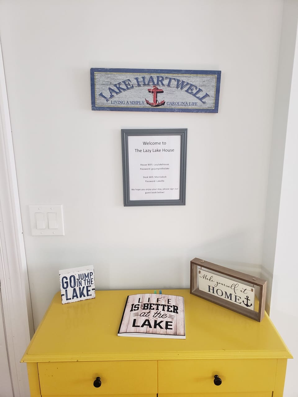 Entry table by front door with wifi info. Please sign our guest book!