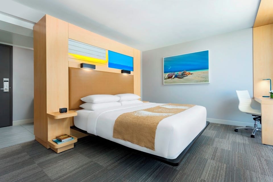 Stretch out on crisp linens in a modern, airy room.