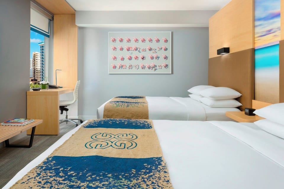 Settle in together with two plush beds and serene decor.
