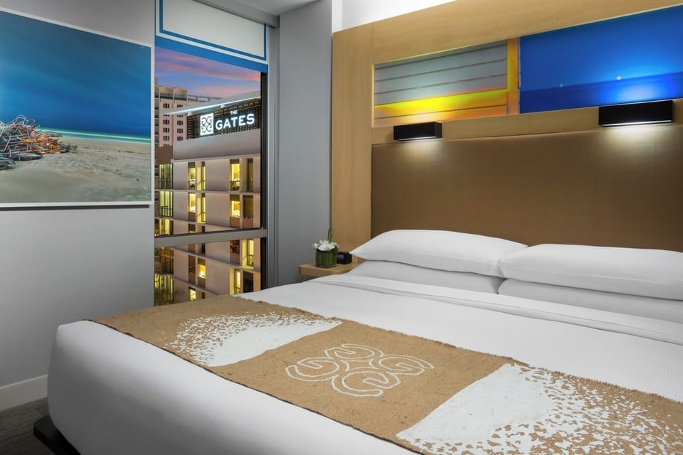 Drift off in a modern king bed with skyline views.