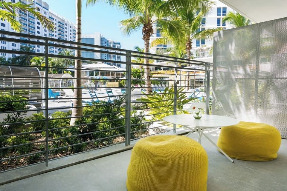 Sip morning coffee overlooking palms and the sparkling pool.