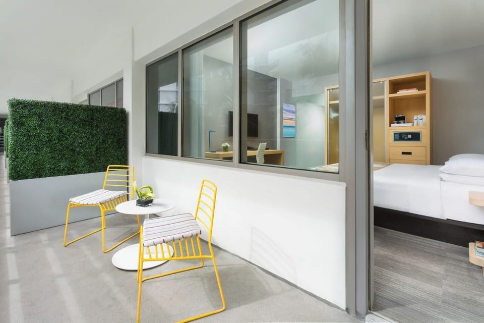 Step outside to a private patio for breezy relaxation.