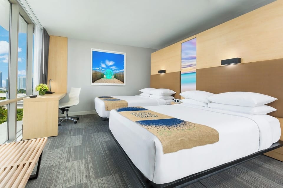 Unwind in crisp linens with sunlit city views.