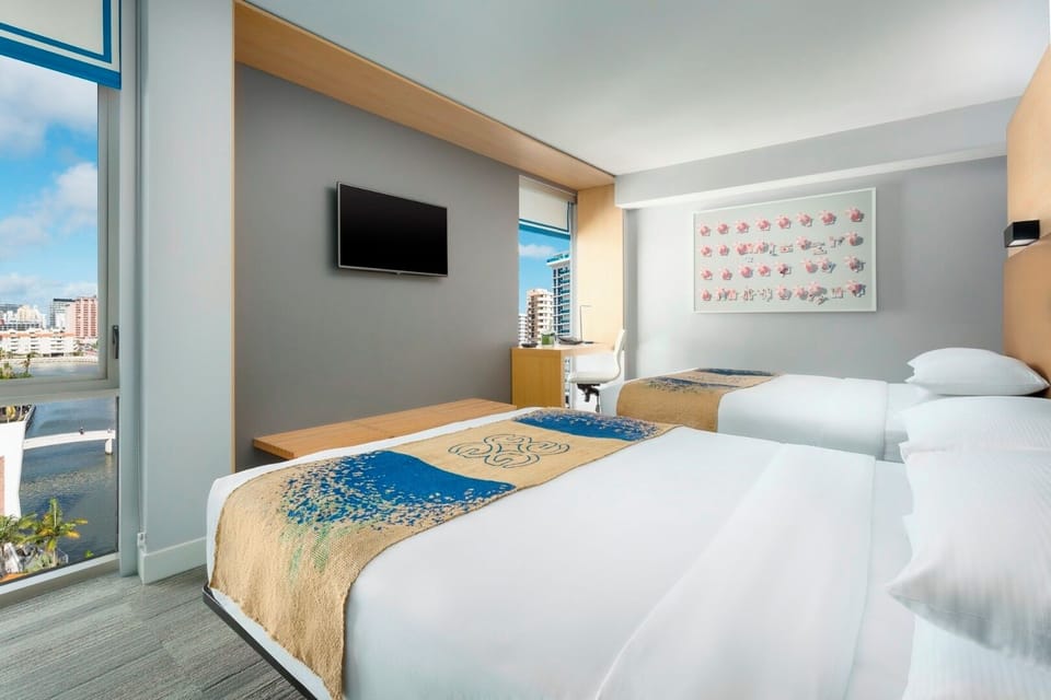 Stretch out comfortably with two beds and a sleek TV.
