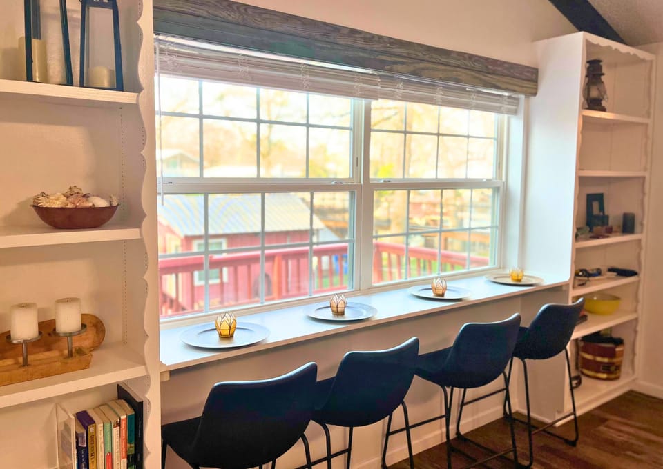 The breakfast bar overlooks our sun porch, back yard, and waterfront. 