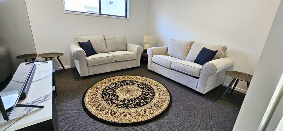 Relax on the spacious sofa and catch your favorite shows on the Smart TV – perfect for winding down after a day out.
