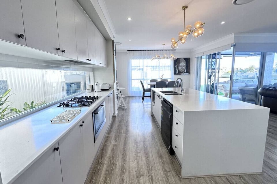 Light-filled and beautifully appointed, the kitchen at Lotus is designed for both style and practicality. Featuring a 900mm gas cooktop and oven, dishwasher, Panasonic microwave, slow cooker, air fryer, and a Nescafé pod machine for your morning coffee, i