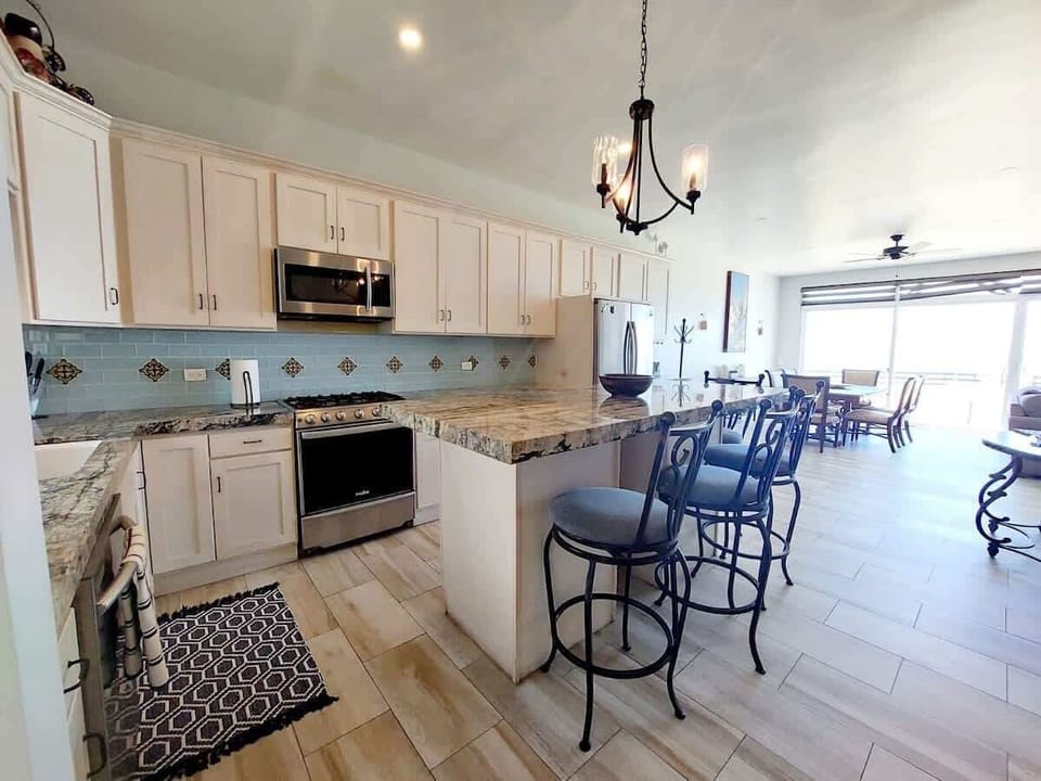 Fully equipped kitchen with seating area