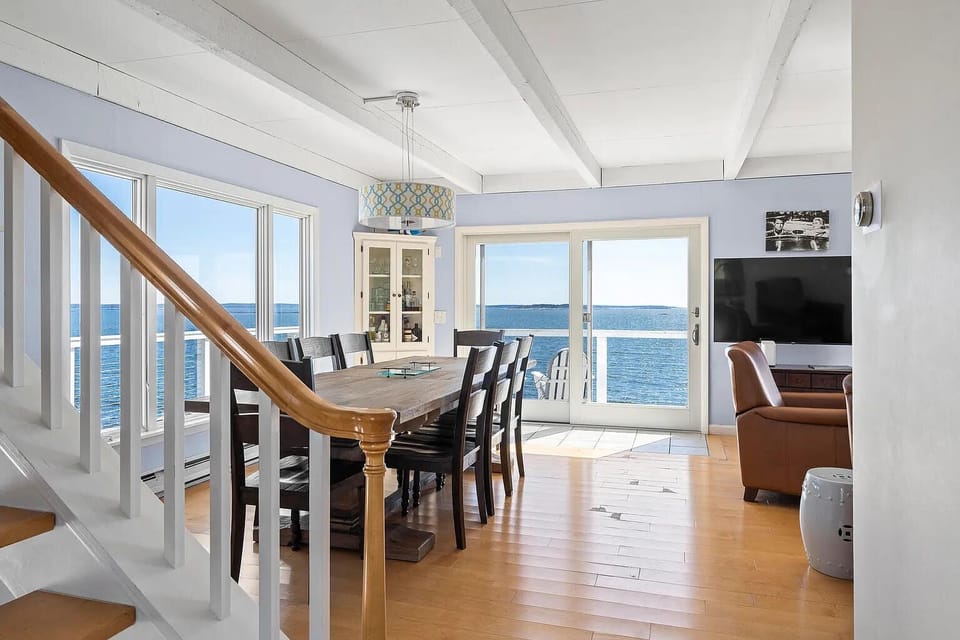 Open ocean views from the dining/ living area with sliding glass doors to the new deck.