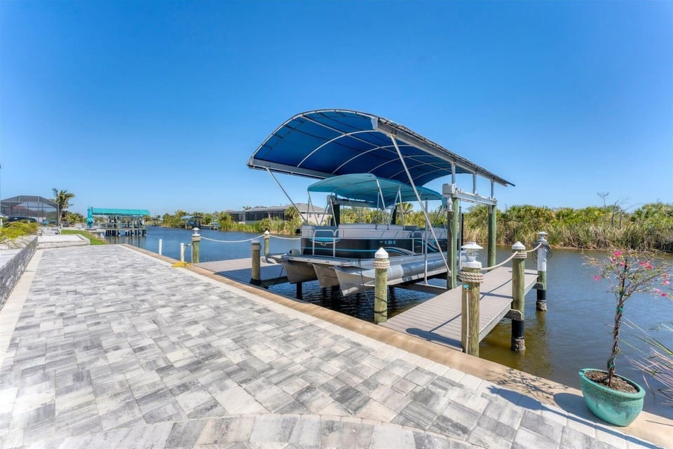 Large dock and seating area. Dock size: 26' x 13'. Dock also includes water & electricity (Boat lift not available)