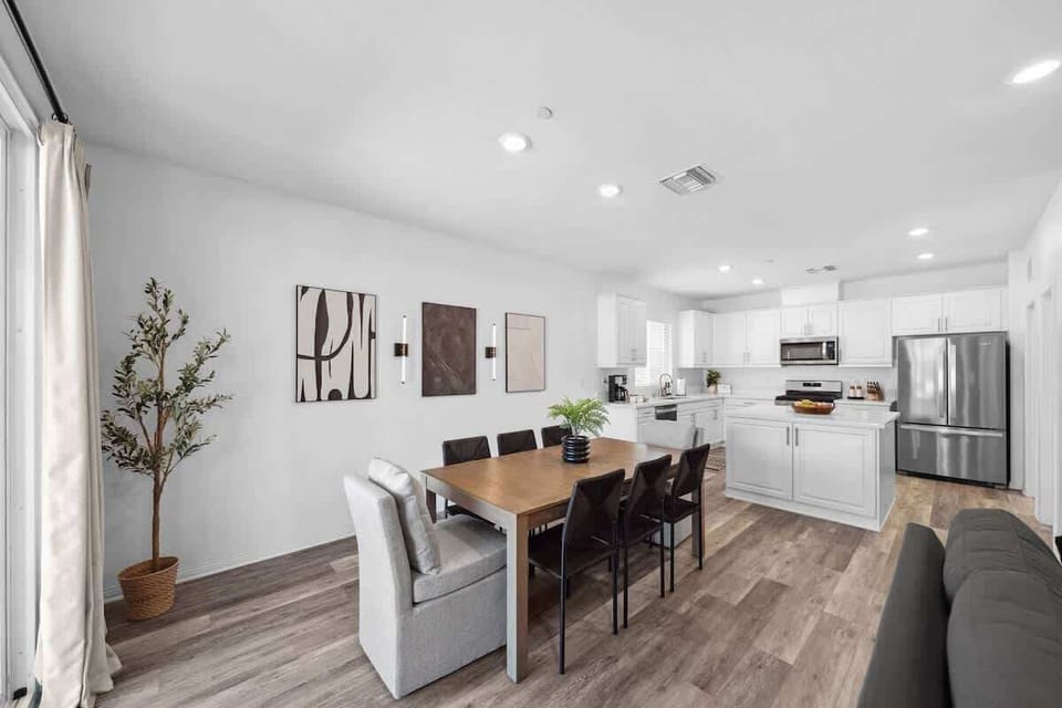 Dining Area: Warm and inviting dining space with a comfortable table setup,  perfect for sharing meals, conversations, and quality time with family or friends.