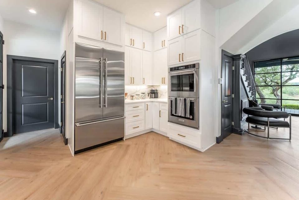Stainless steel fixtures and ample storage in this chef’s kitchen.