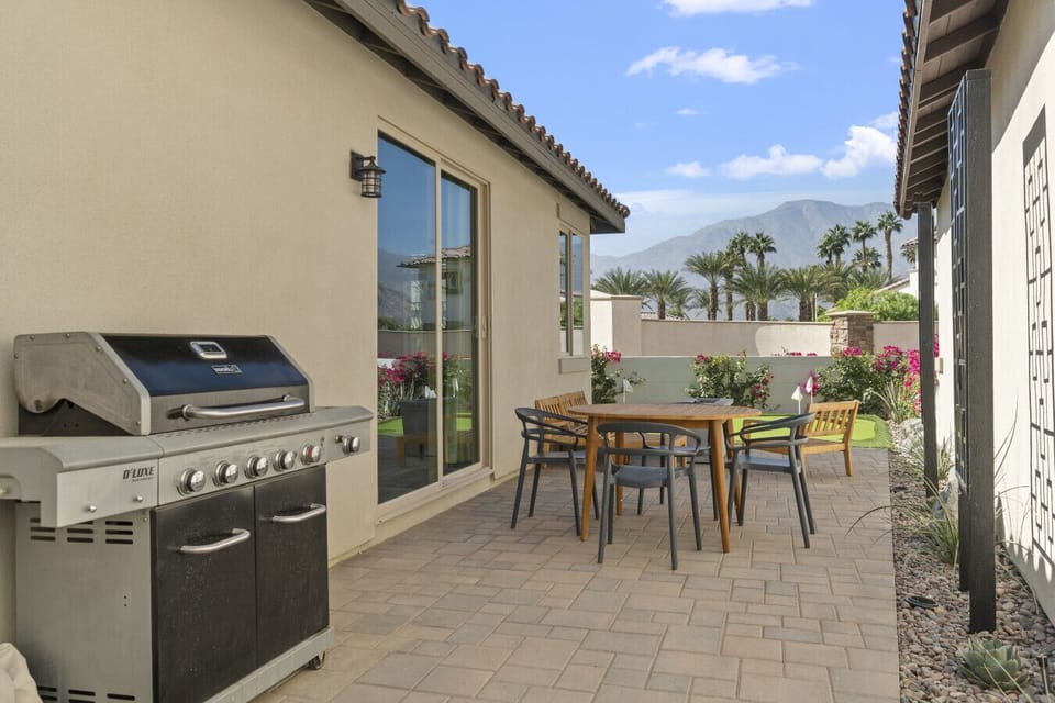 Private patio w/ BBQ grill & dining table, perfect for easy outdoor meals