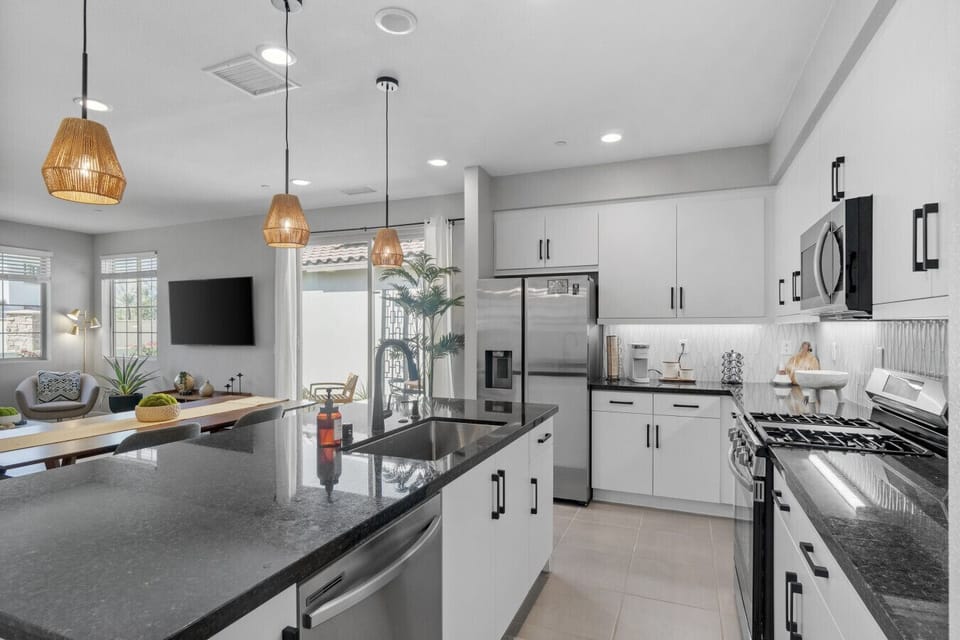 Open kitchen layout w/ spacious counters & seamless flow into the living space