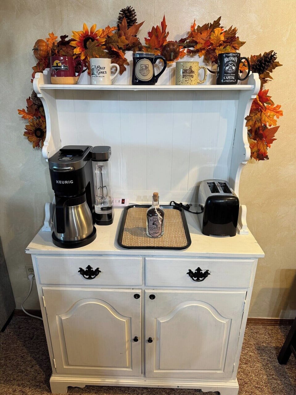 Enjoy the coffee bar with a few coffee pods provided in the left drawer. The cups are from some of our local favorites from around town.