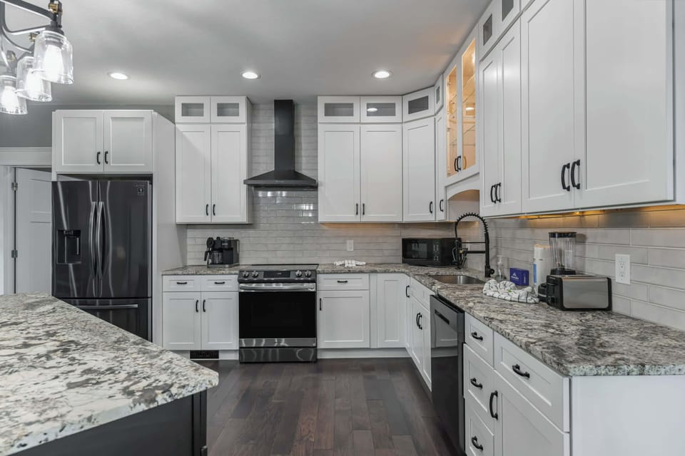 Modern kitchen with granite countertops and stainless steel appliances
