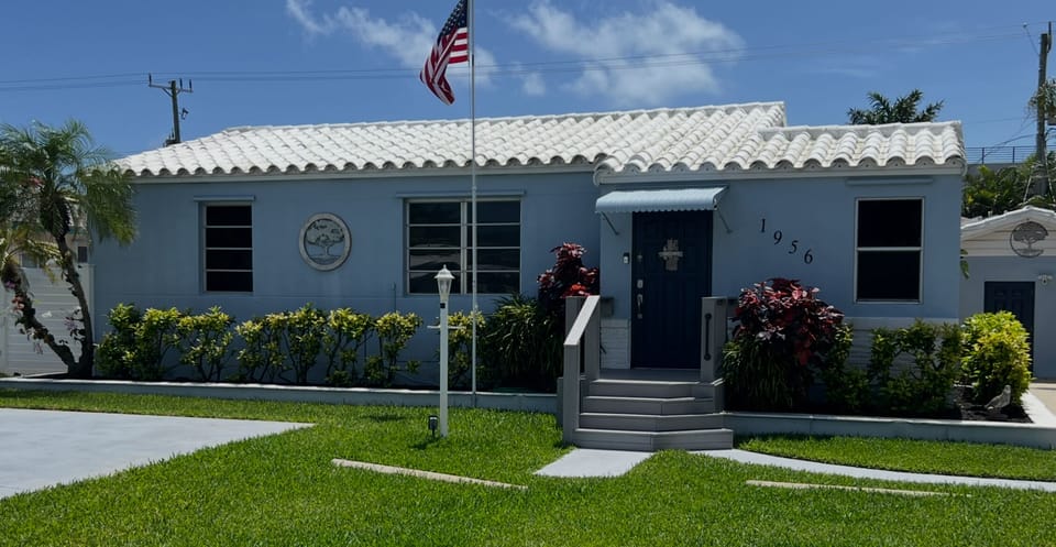 Front of house with safety steps and railings