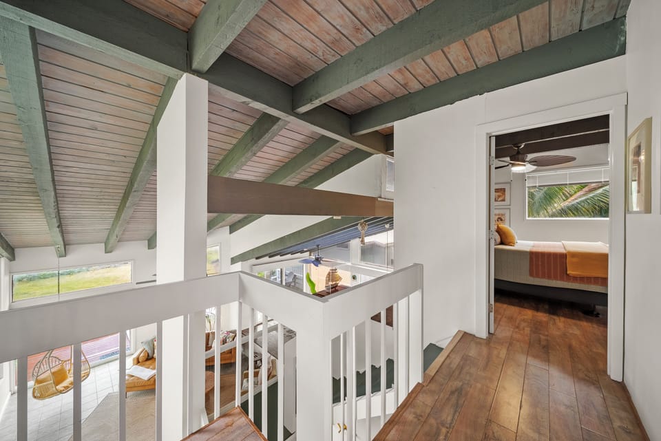 Modern architectural design with exposed beams, creating an open and breezy island retreat.