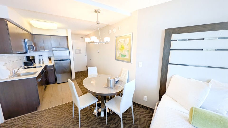 Cozy Dining Area with Table and Chairs for Your Meals.