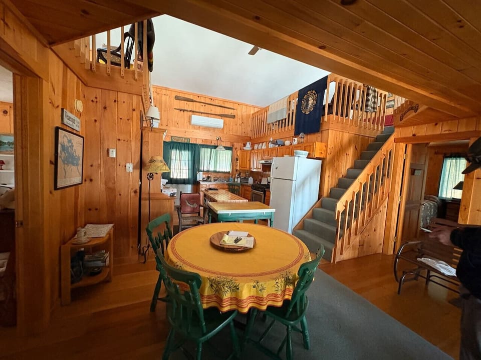 Spacious kitchen and dining area with wood-paneled charm, and full amenities