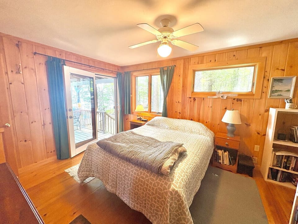 Cozy bedroom with direct access to the deck — perfect for enjoying the morning breeze.