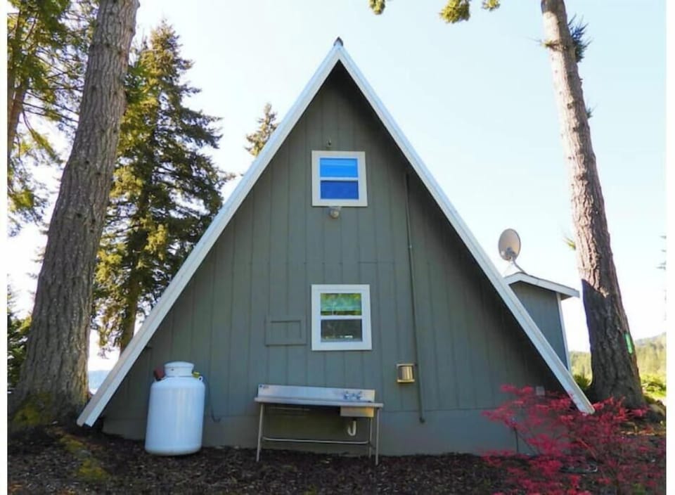 Backside of the cabin with a catch/game cleaning station